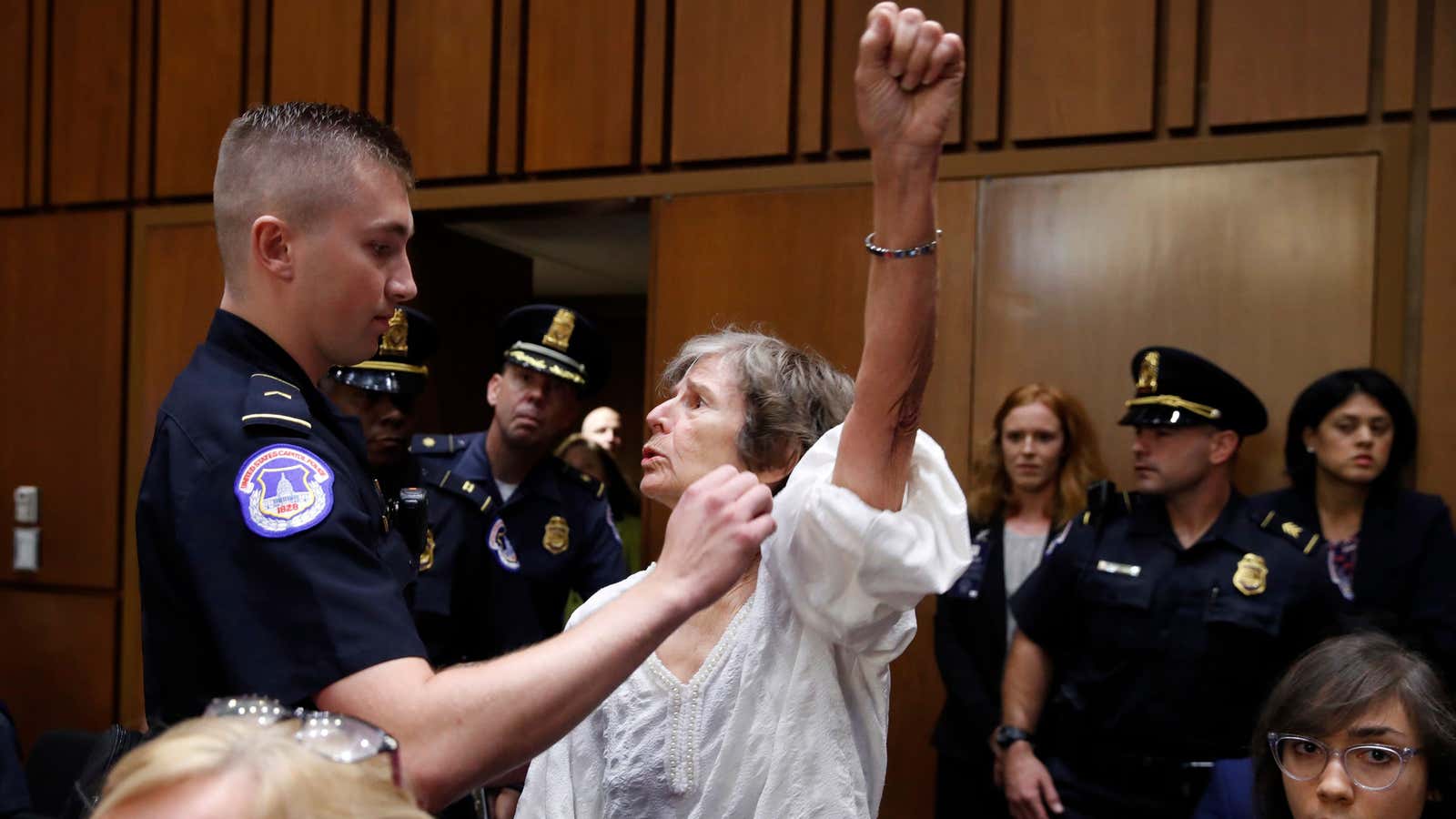 An unidentified protestor is arrested during Kavanaugh’s hearing.