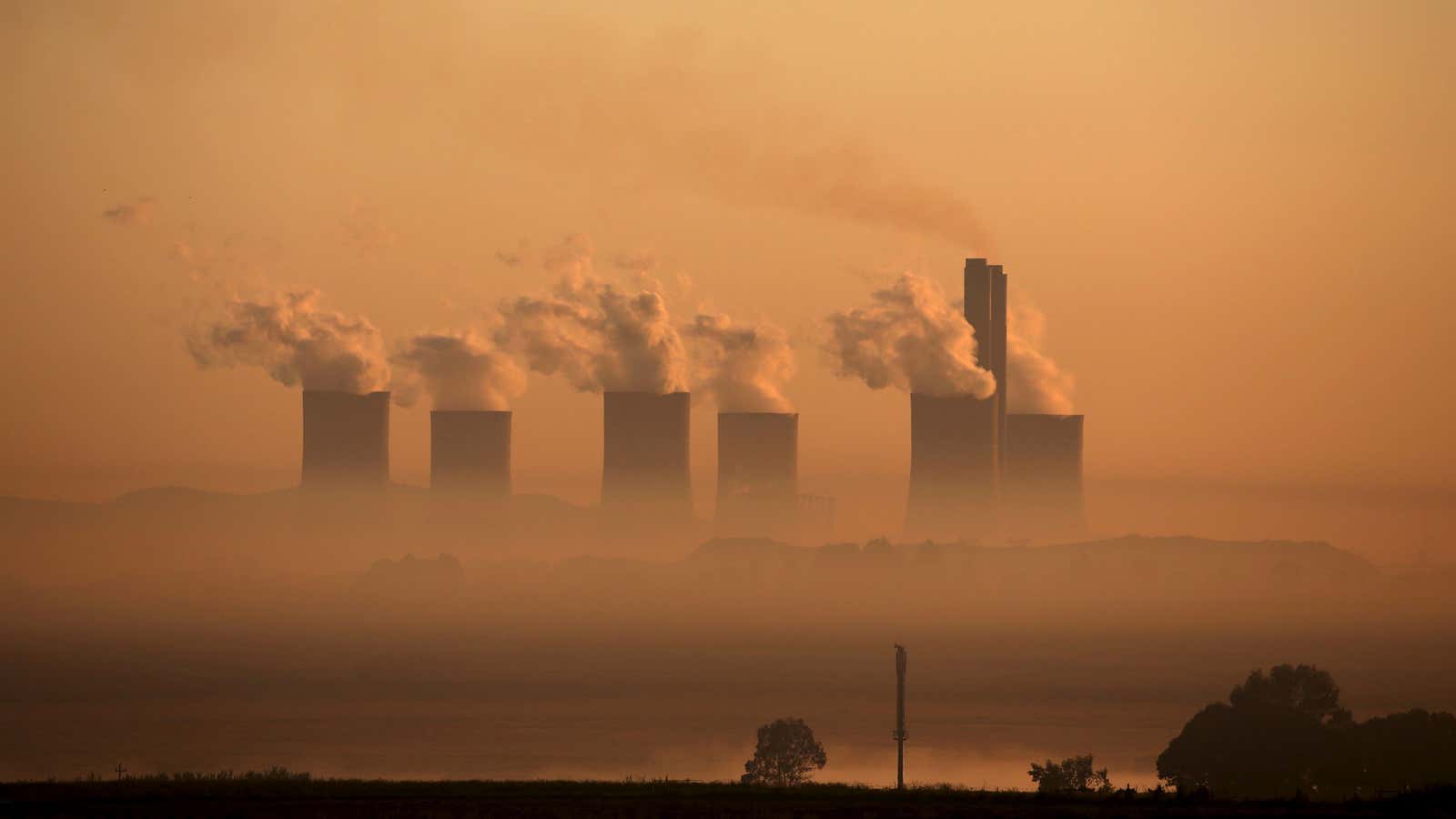 Steam rises at sunrise from the  Lethabo Power Station, a coal-fired power station owned by state power utility Eskom near Sasolburg, South Africa,