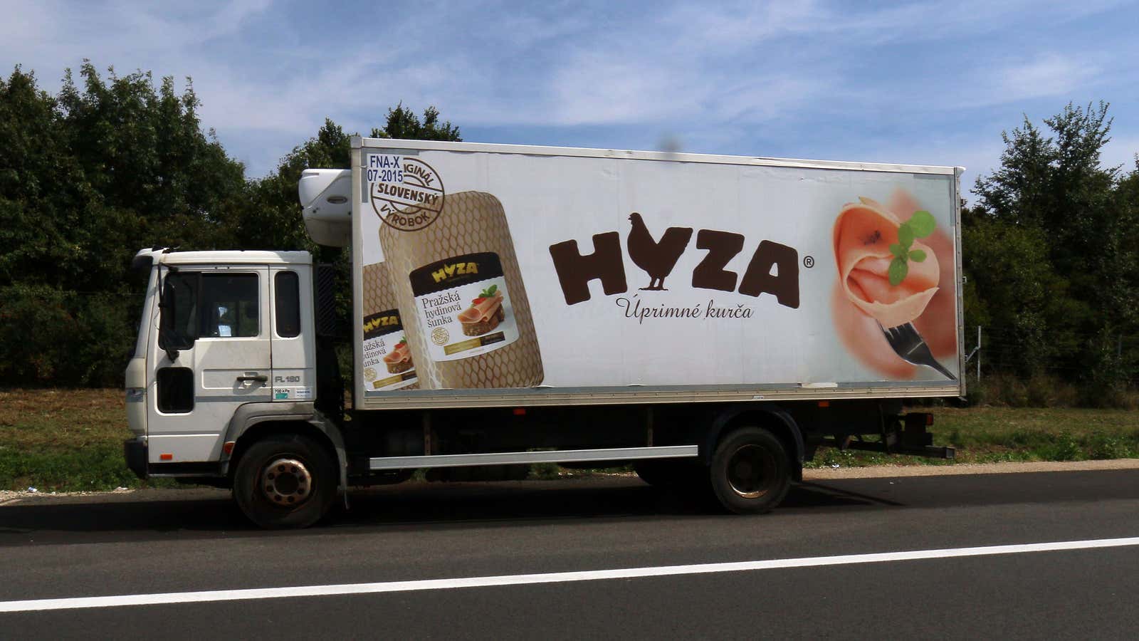 The truck bore the logo of a meat producer.