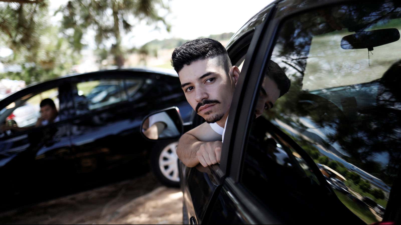 Uber drivers sit in their cars as they wait for passengers in Sao Paulo, Brazil, February 13, 2017. To match Insight UBER TECH-BRAZIL/ Picture taken…