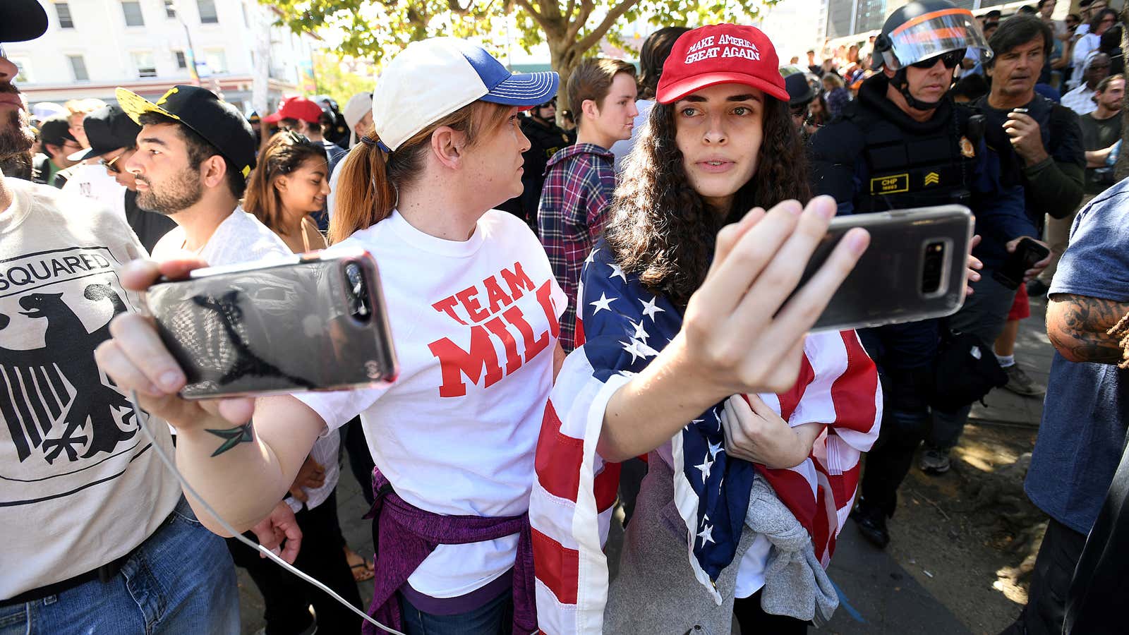 Conservative protesters rally to hear Milo Yiannopoulos speak at the University of California-Berkeley.
