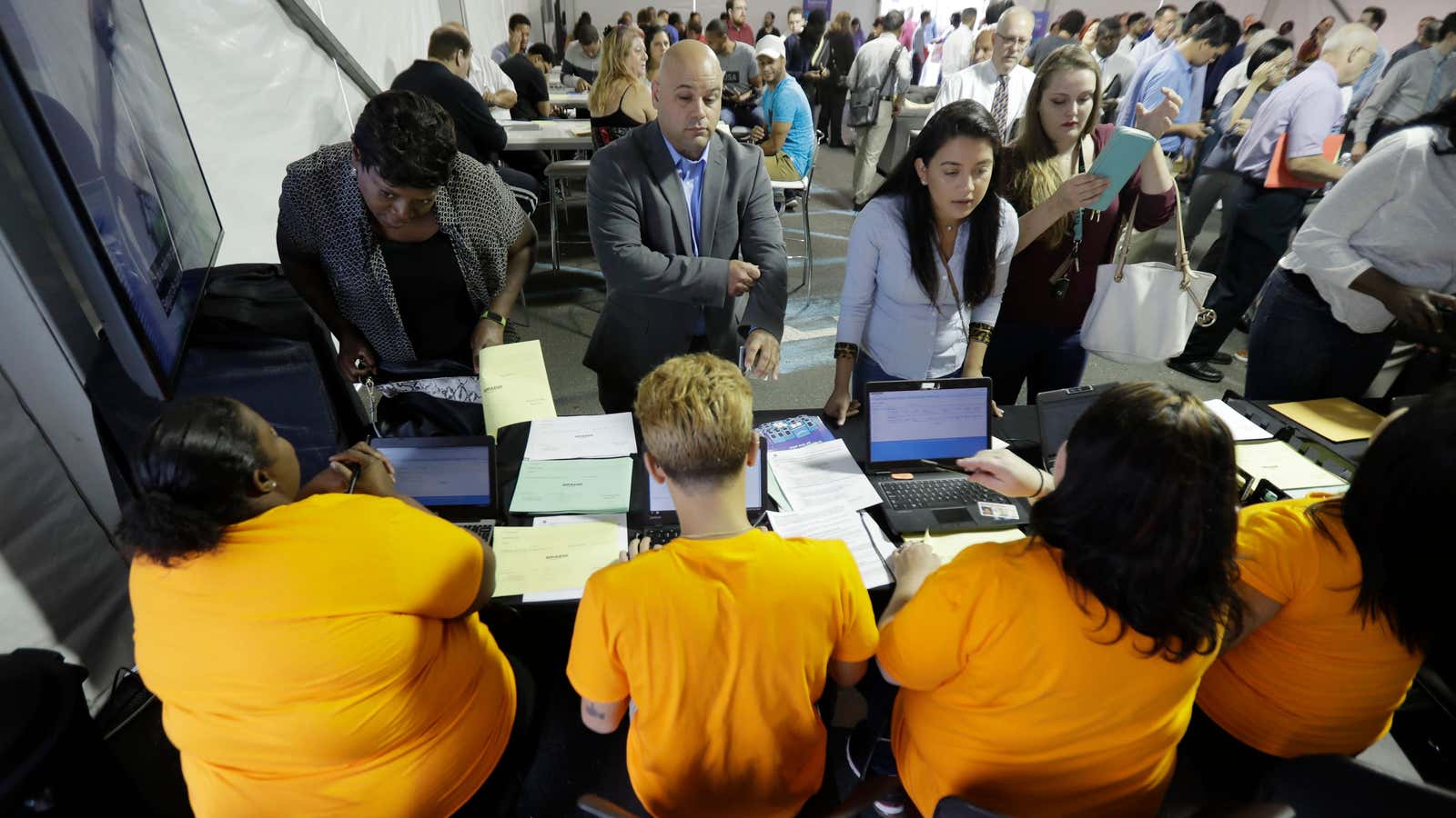 Job candidates are processed during a job fair at an Amazon Fulfillment center.