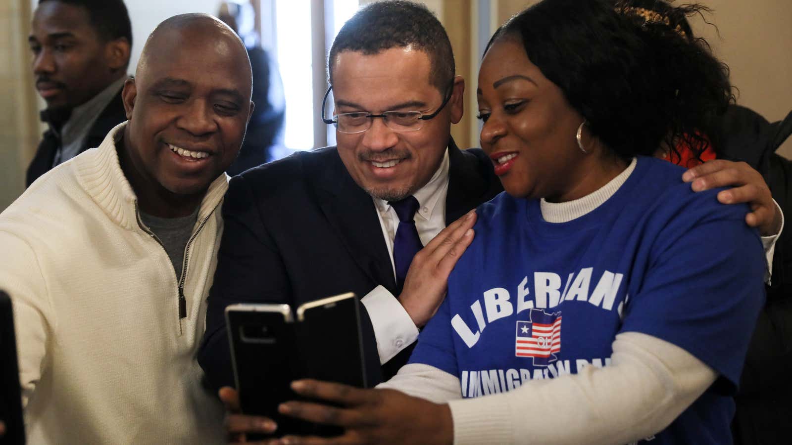 Liberian activists take a selfie with Minnesota Attorney General Keith Ellison at a Deferred Enforced Departure (DED) immigration status rally in St. Paul, Minnesota, U.S on Feb. 22 2019.