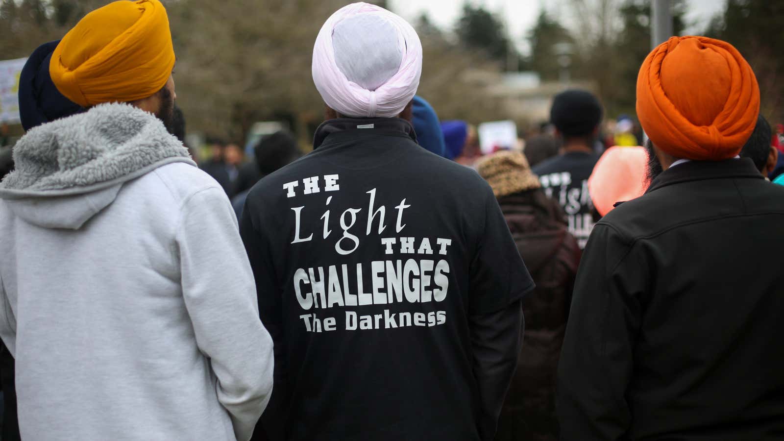 A Sikh man’s shirt bears a reference to human rights activist Jaswant Singh Khalra during a vigil in honor of Srinivas Kuchibhotla, an immigrant from…