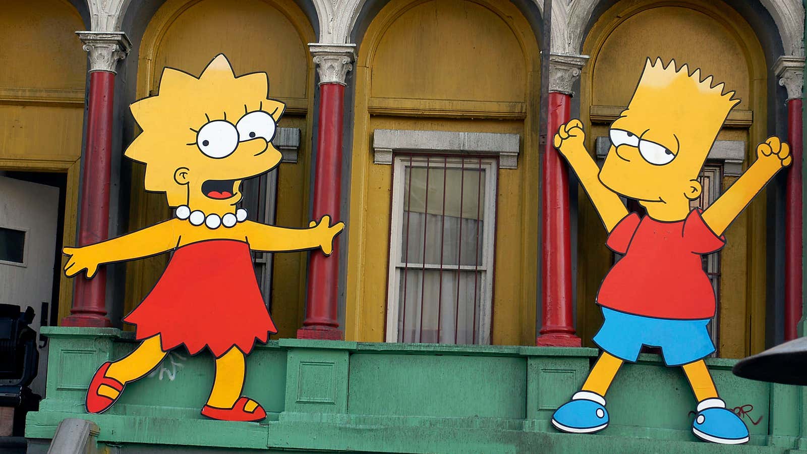 Lisa Simpson and Bart Simpson cut-outs on display at “The Simpsons” 350th episode block party.