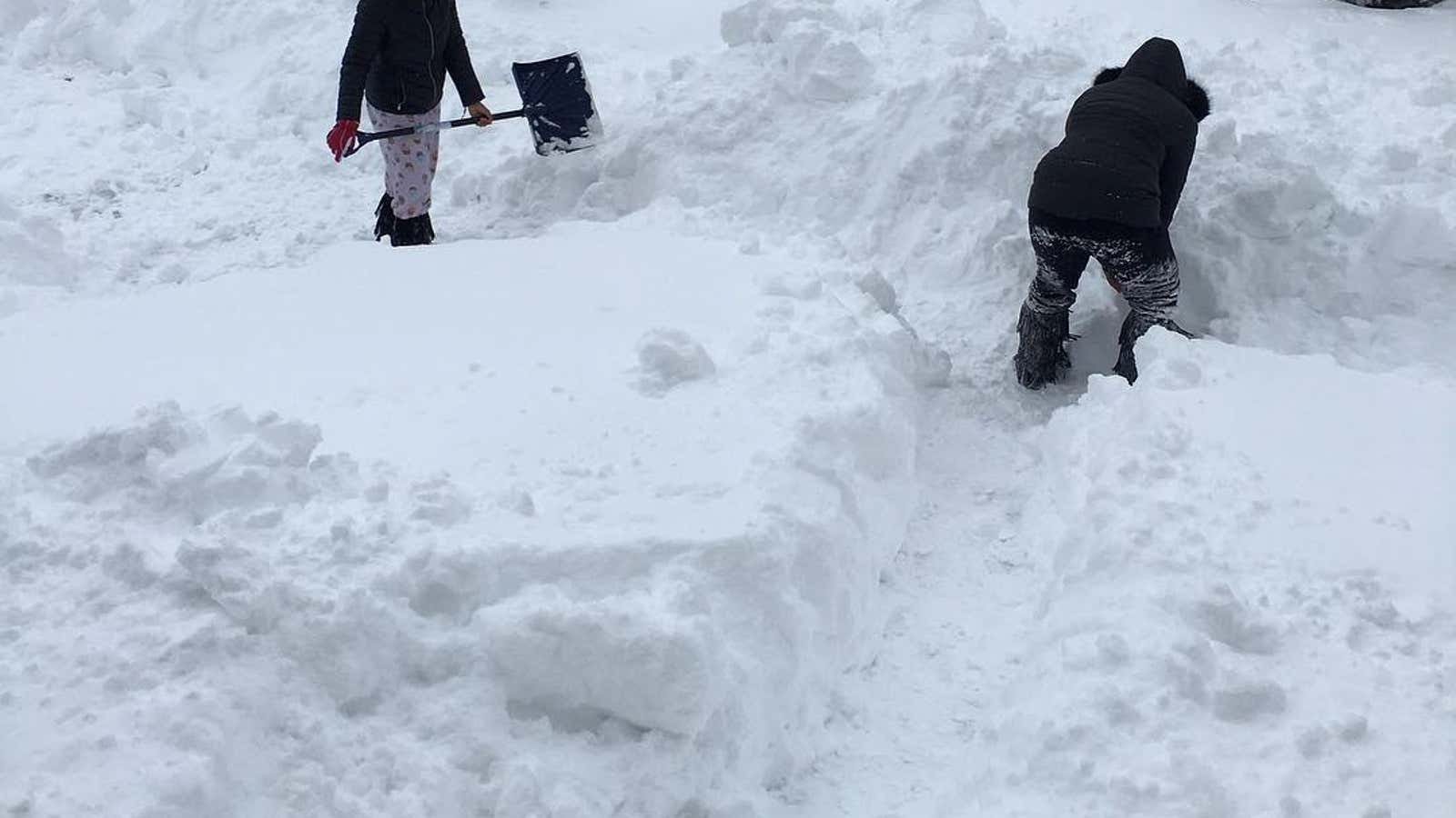 People dig out after the record snowfall in Erie, U.S.