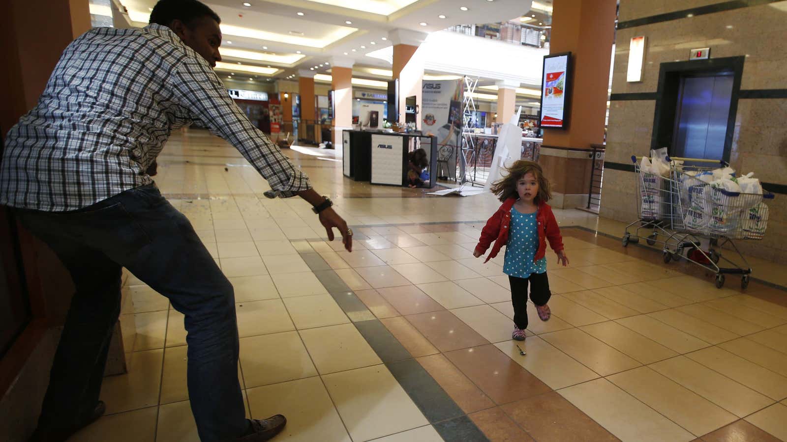A child runs to safety during the attack on Westgate in 2013.