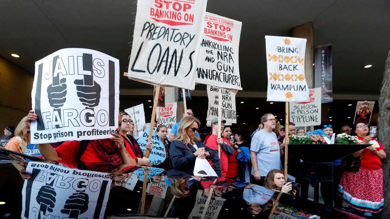 Protesters rally outside the Marriott Hotel during the Wells Fargo annual shareholders’ meeting in 2018.