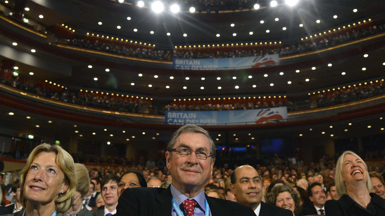 Lord Ashcroft, center, at a Conservative party conference.