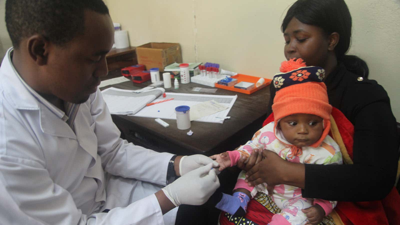 A doctor tests a child for malaria in Arusha, Tanzania,