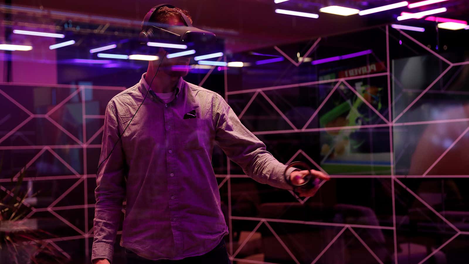 A conference-goer tests the original Oculus Quest headset in 2019.