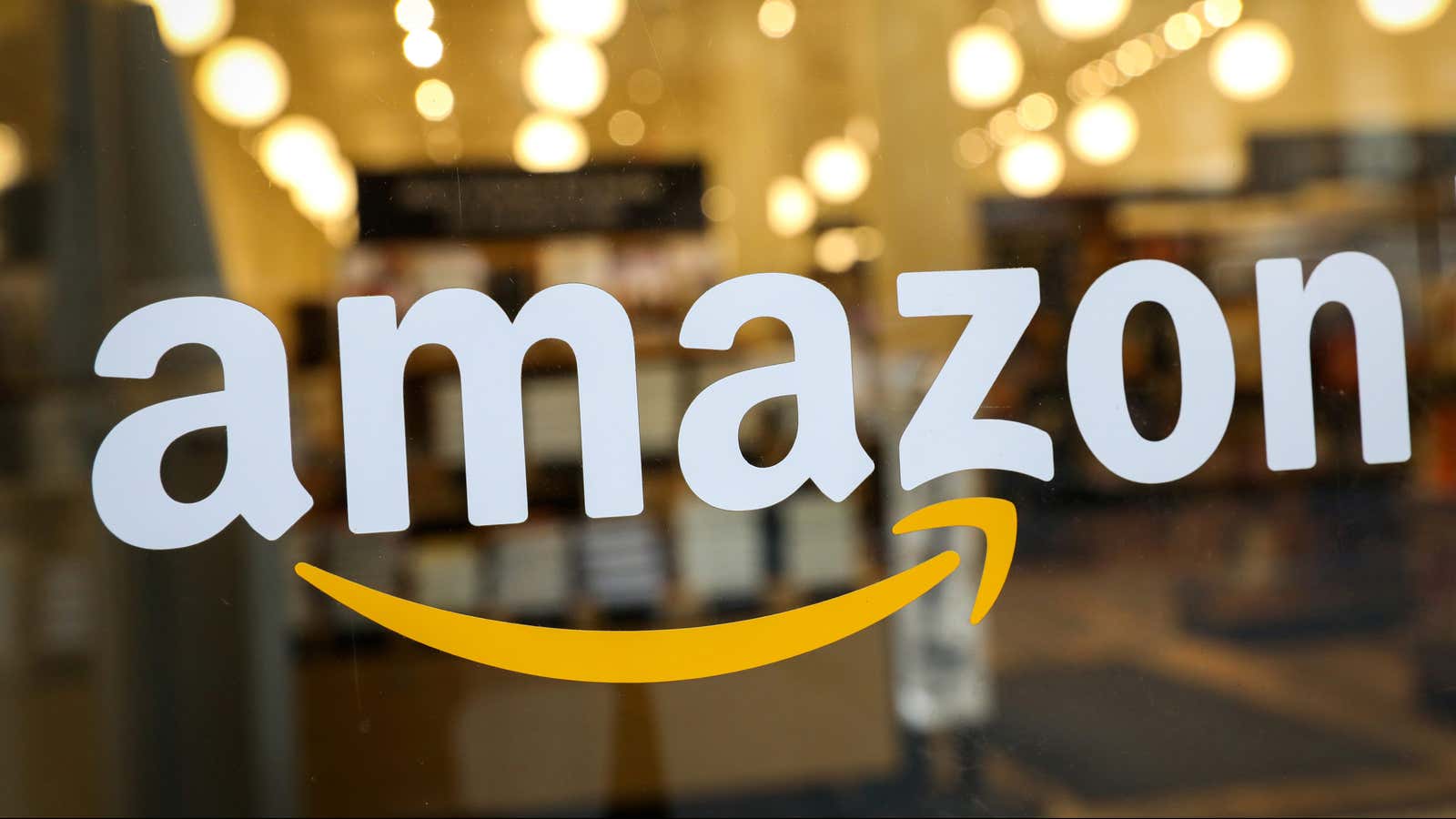 FILE PHOTO: The logo of Amazon is seen on the door of an Amazon Books retail store in New York City, U.S., February 14, 2019.â€¦