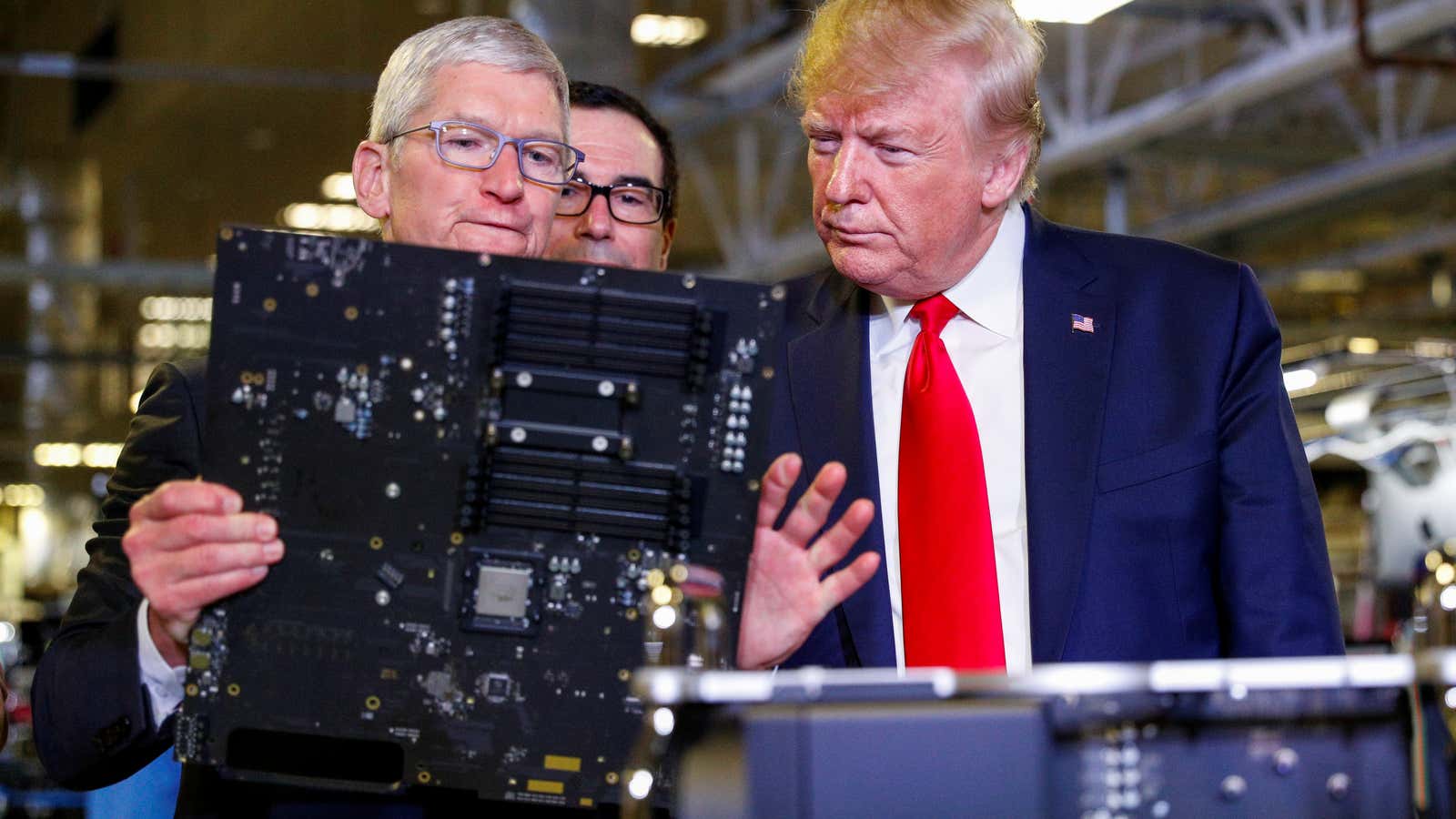 Apple CEO Tim Cook escorts US President Donald Trump as he tours Apple Computer plant in Austin, Texas.