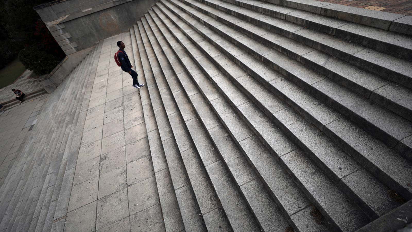 Students walk up steps in front of the University of Cape Town’s Jameson Hall in Cape Town, South Africa, November 13, 2017. REUTERS/Mike Hutchings –…