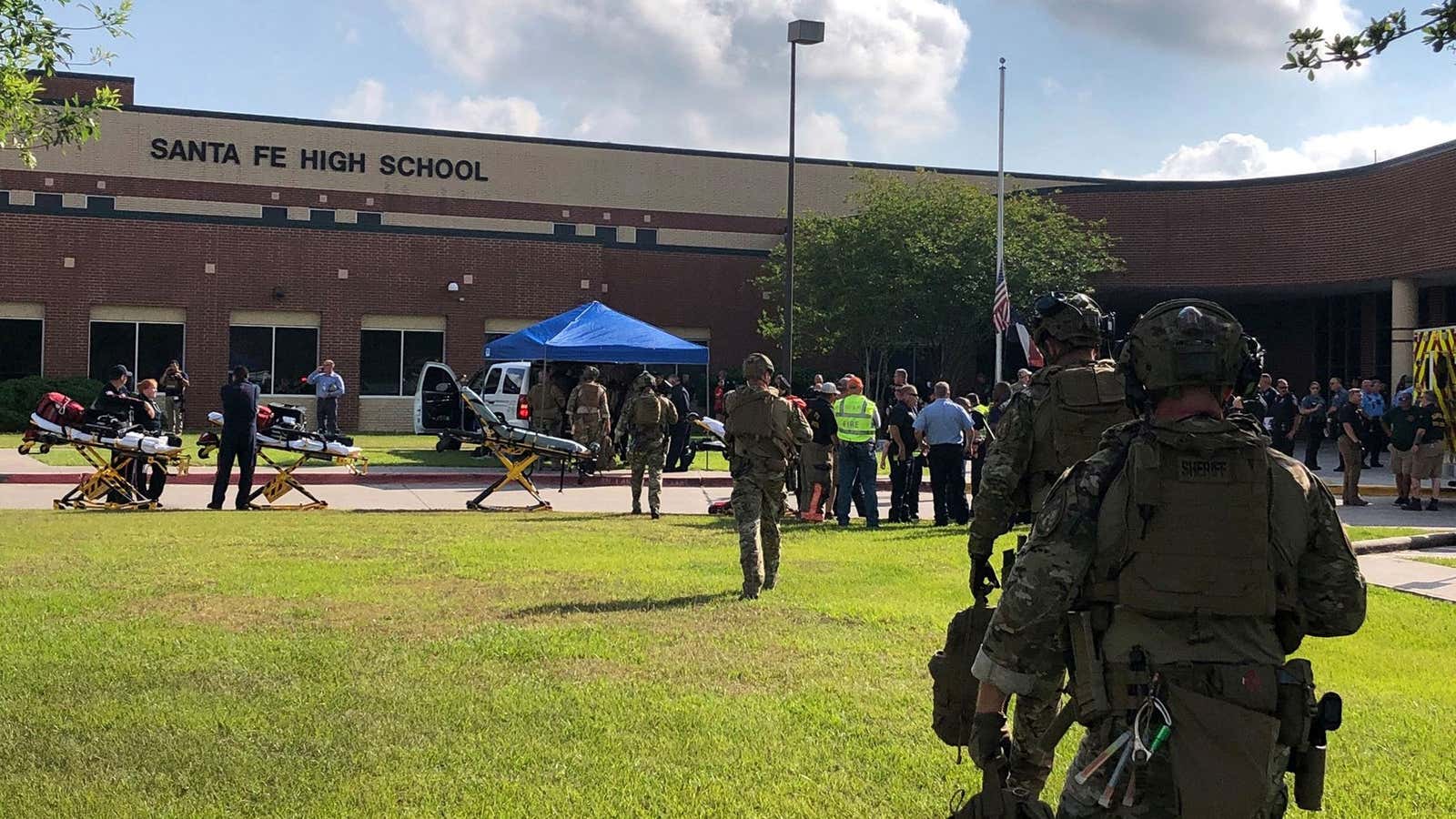 Law enforcement officers respond to Friday’s shooting in Santa Fe, Texas.