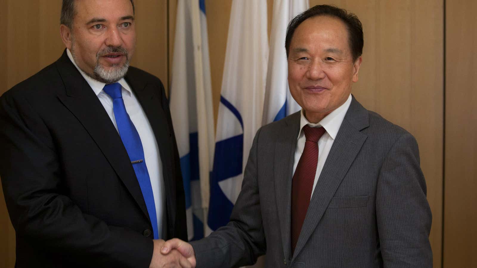 Wu Sike, right, shakes hands with Israeli Foreign Minister Avigdor Lieberman