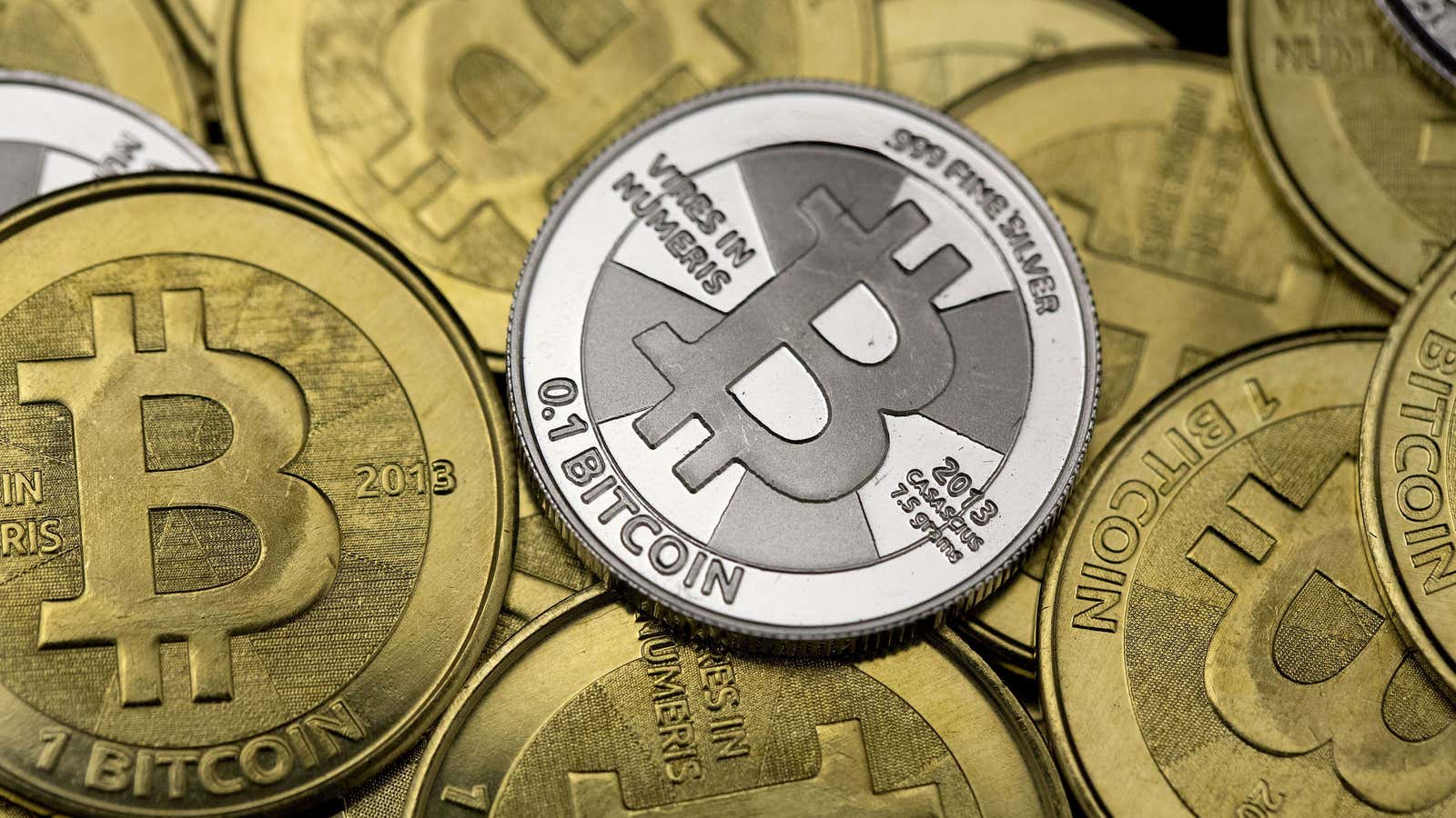 Some of Bitcoin enthusiast Mike Caldwell’s coins are pictured at his office in this photo illustration in Sandy, Utah, January 31, 2014.