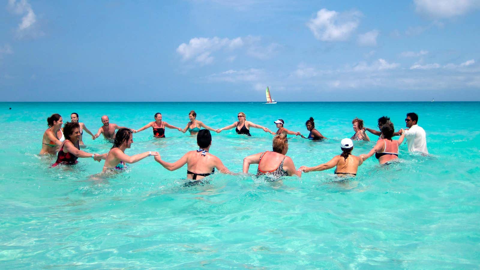 Tourists exercise in the water at the Santa Maria Key Resort in central Cuba April 4, 2013. People pay a lot of money to visit…