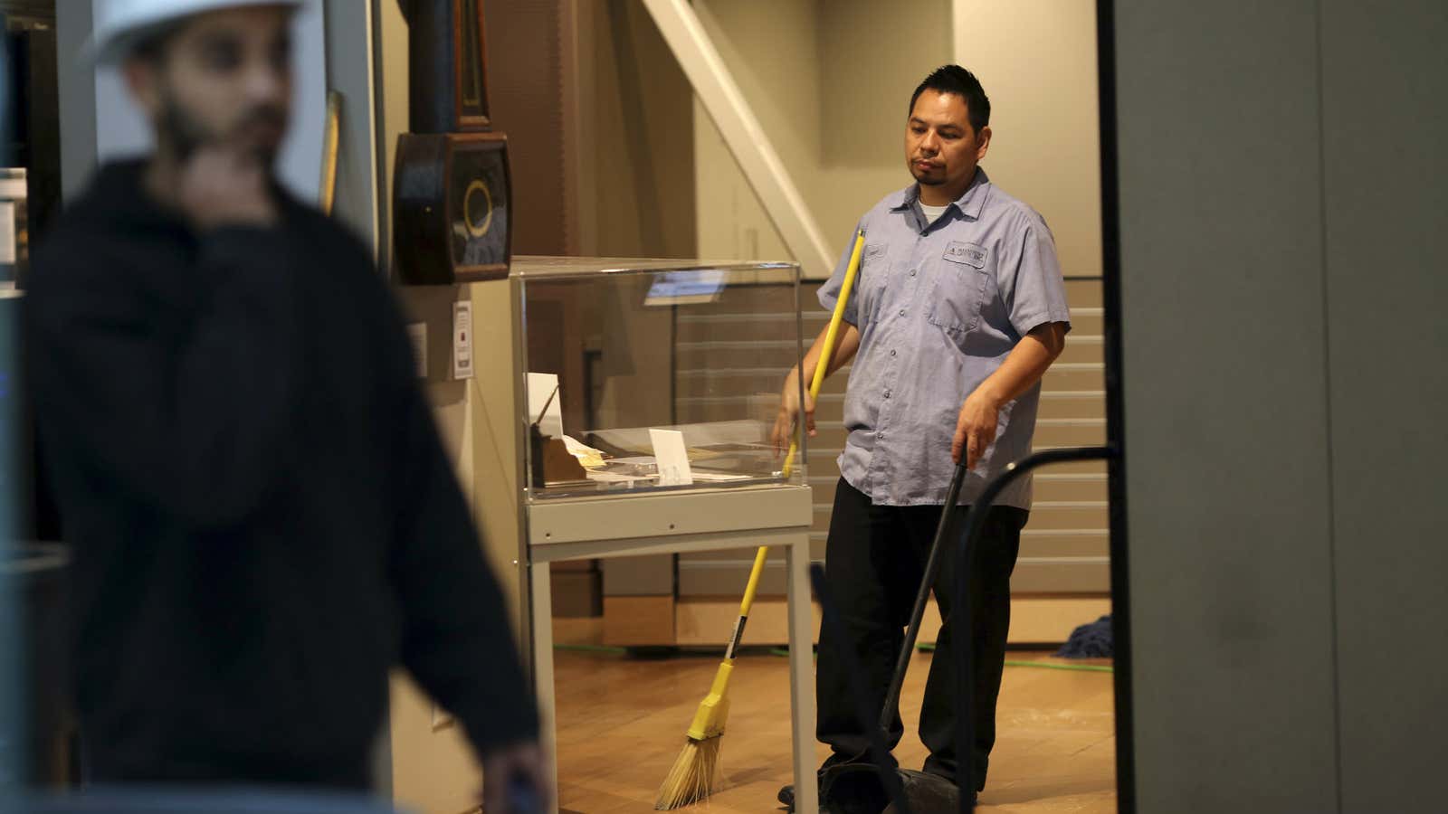 A worker sweeps inside the Wells Fargo History Museum in San Francisco, California.