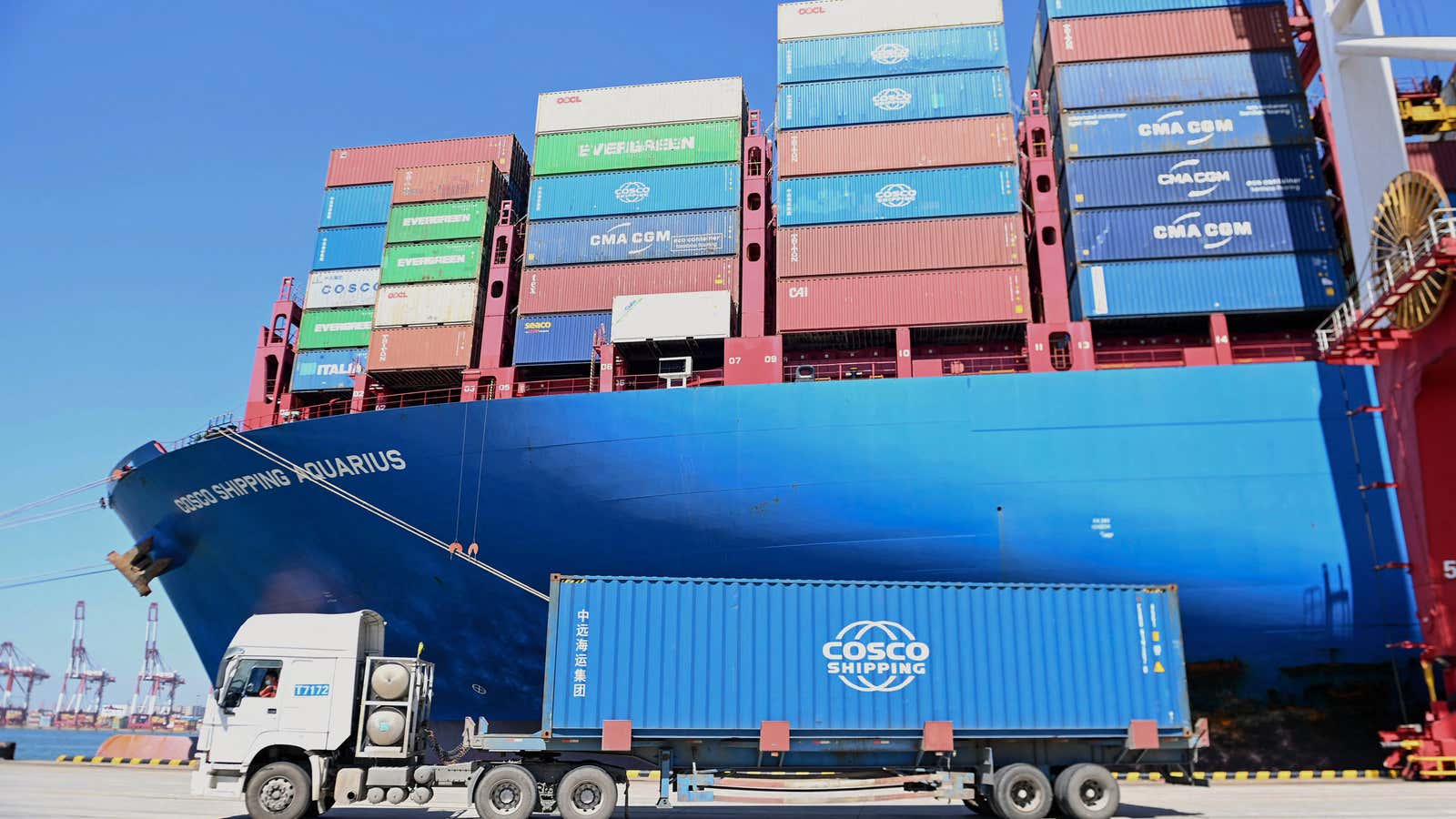 A cargo ship loaded with containers is seen at a port in Qingdao, in China&#39;s eastern Shandong province on September 7, 2022. 