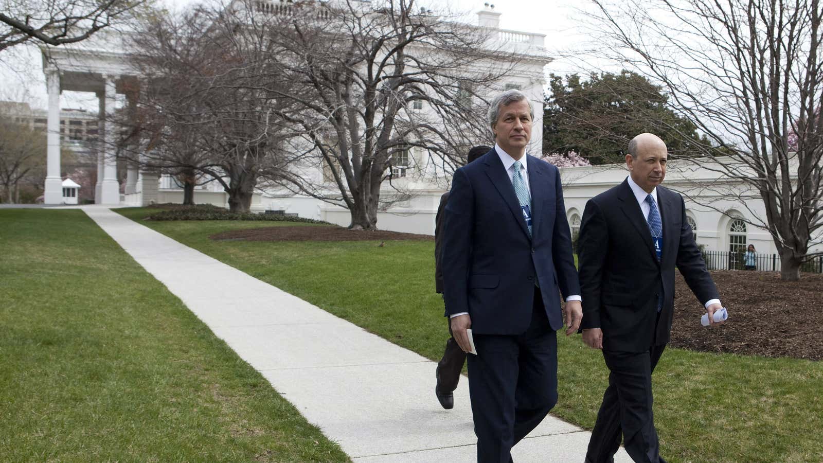 Lloyd Blankfein, pictured right, leaving the White House with JP Morgan CEO Jamie Dimon. Neither will be there today.