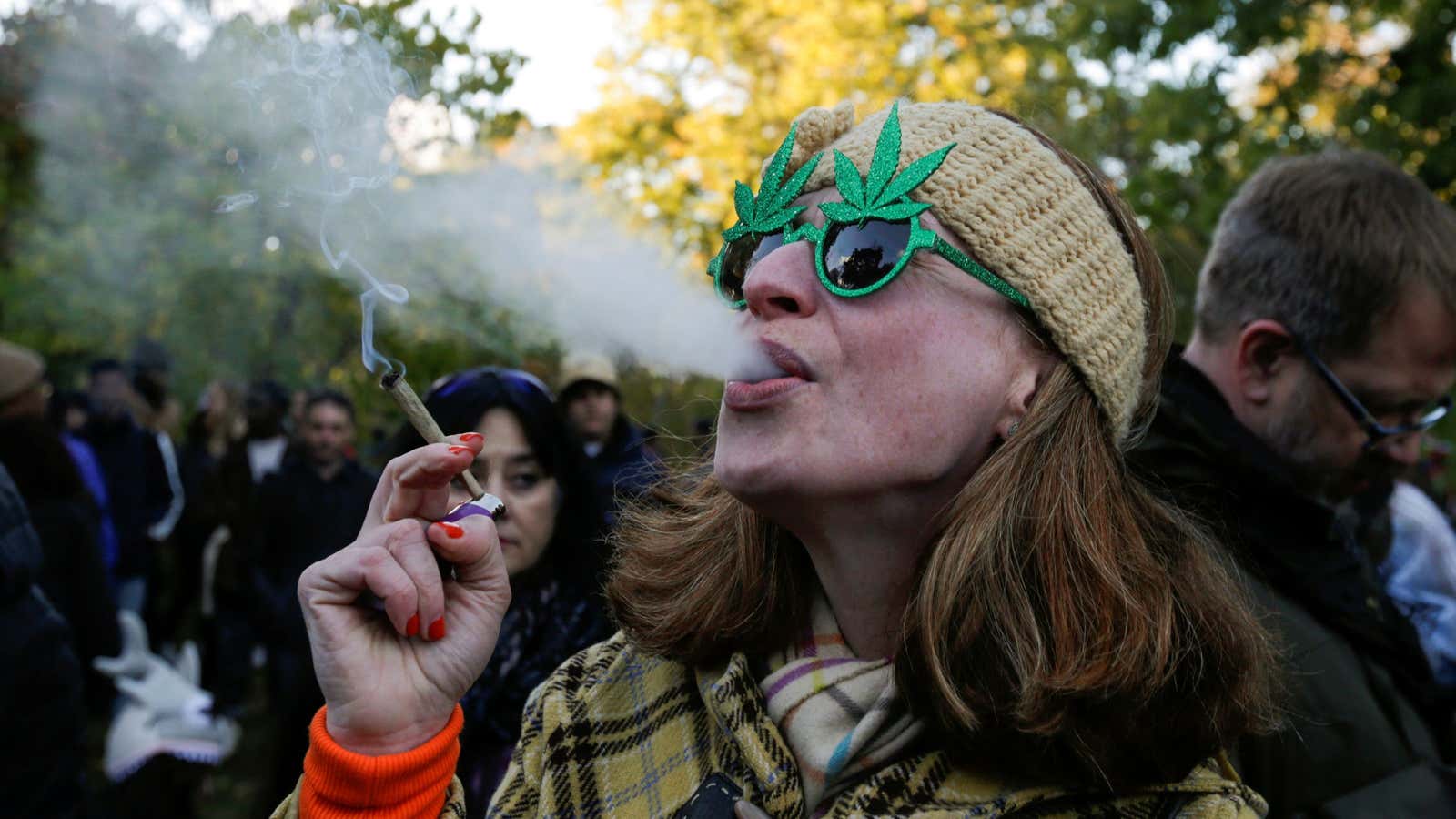 A woman smokes a joint on the day Canada legalizes recreational marijuana at Trinity Bellwoods Park, in Toronto, Ontario, Canada, October 17, 2018. REUTERS/Carlos Osorio…
