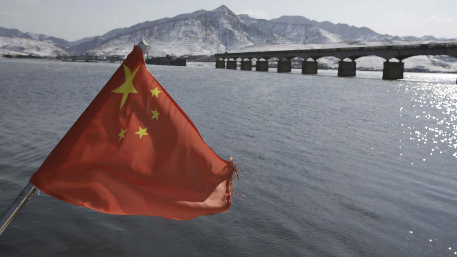 A Chinese flag near the Hekou Bridge that links China and North Korea.