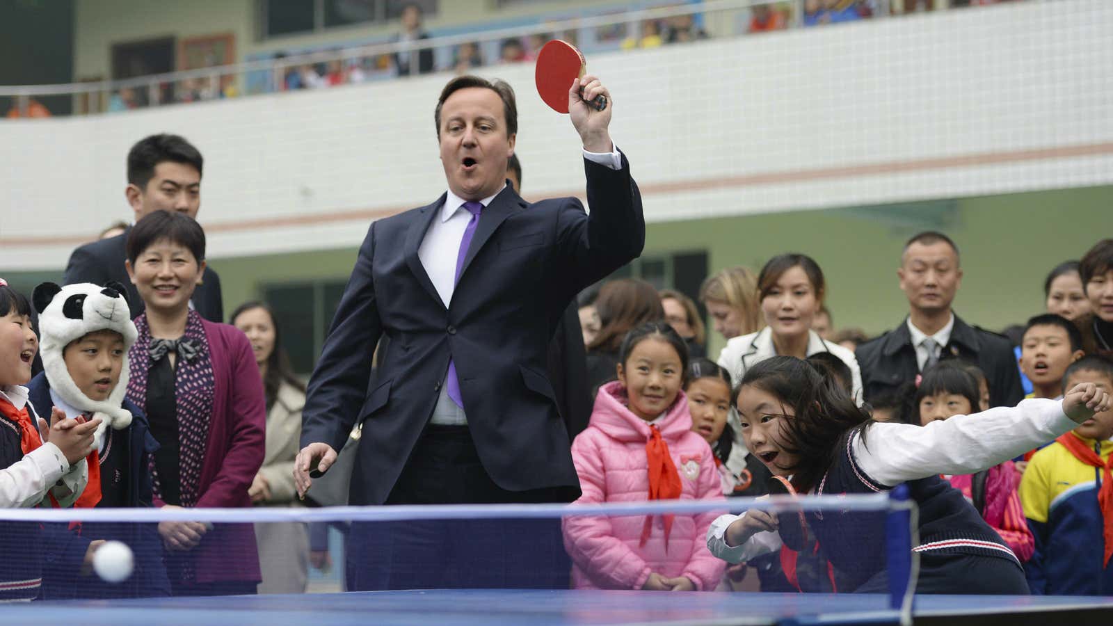 David Cameron plays ping pong with primary school kids during his trip to Chengdu.