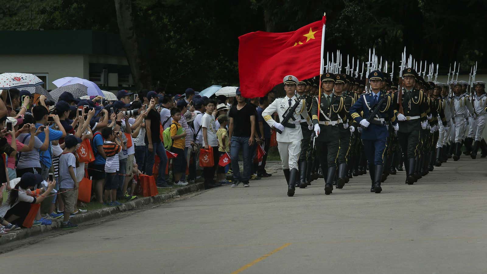 PLA soldiers march in Hong Kong.