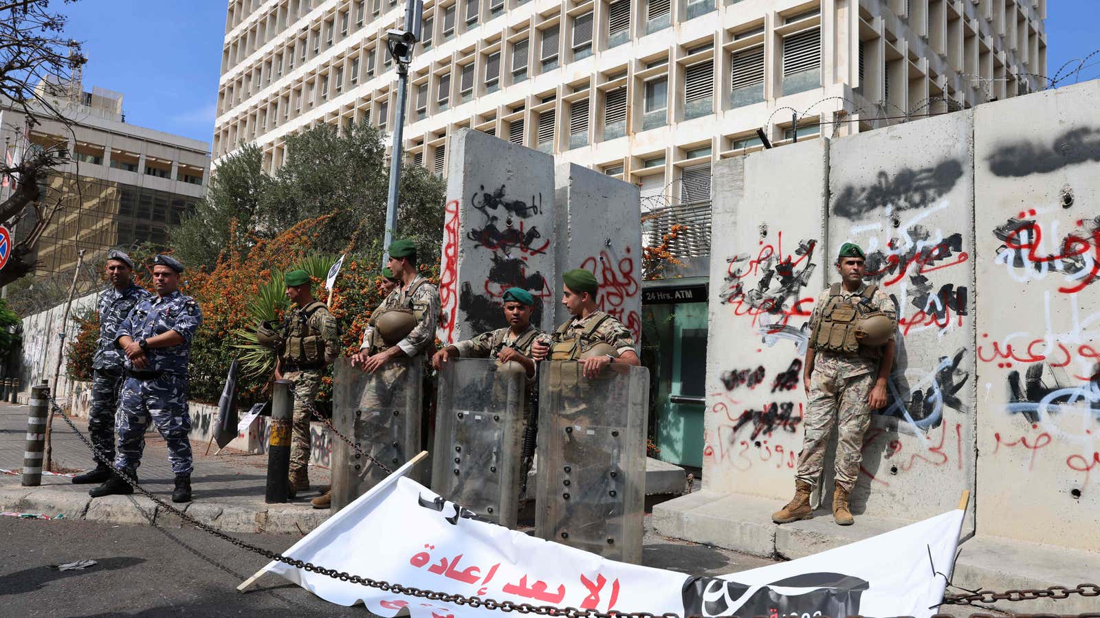 Police stands guard at a protest organised by &quot;Depositors&#39; Outcry&quot; to ask for their deposits blocked in Lebanese banks