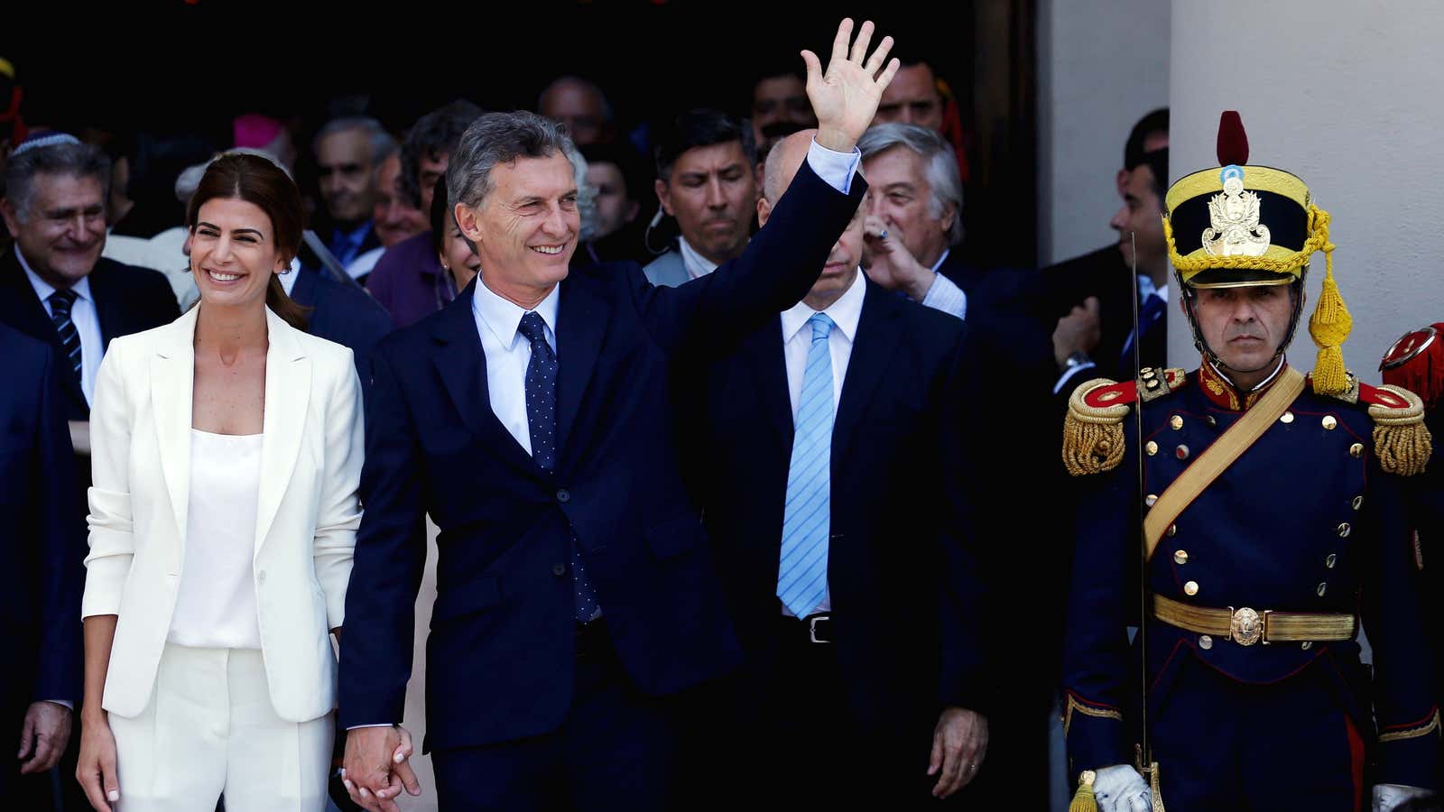 Argentina’s new president, Mauricio Macri, waves alongside first lady Juliana Awada (L) outside Buenos Aires’s main cathedral on Dec. 11, 2015.