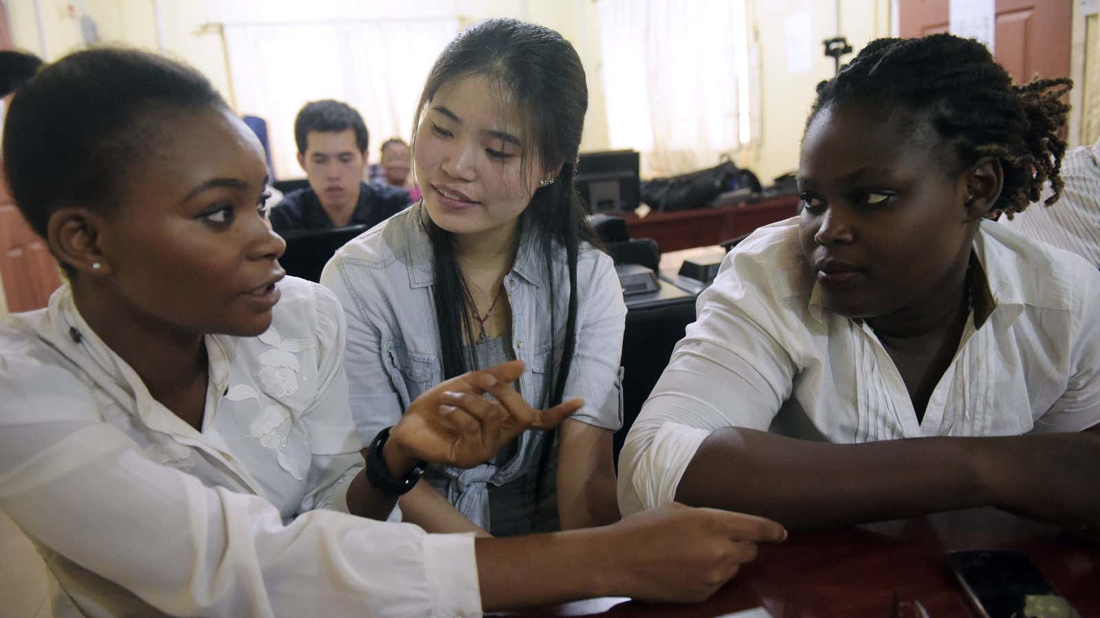 A Chinese language teacher speaks with students at the Confucius Institute at the University of Lagos