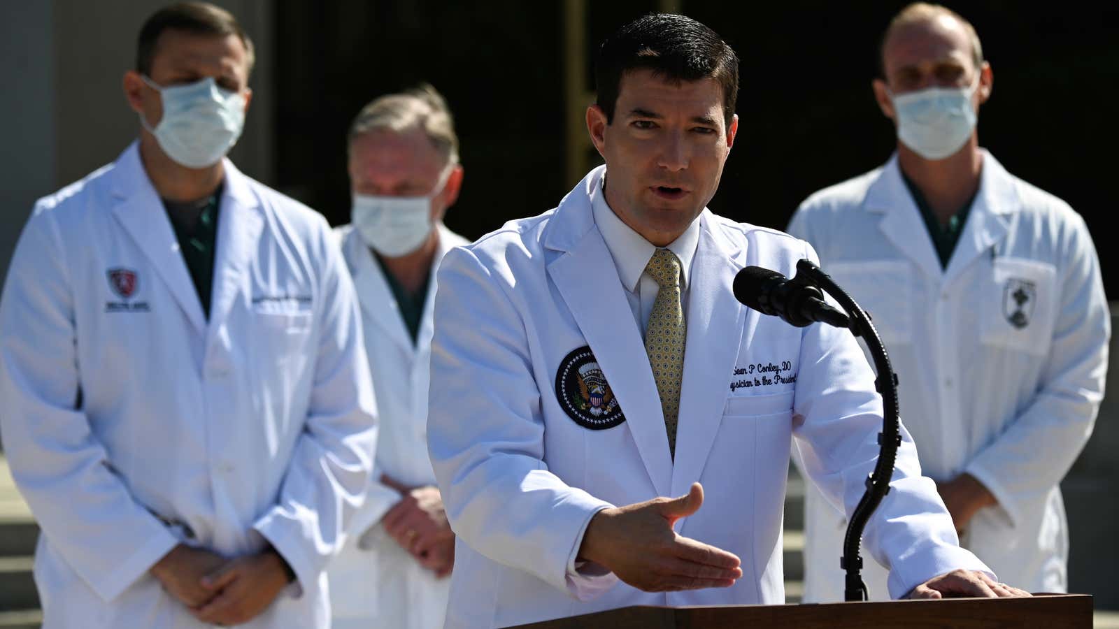 U.S. Navy Commander Dr. Sean Conley, the White House physician, is flanked by other doctors as he speaks to the media about U.S. President Donald…