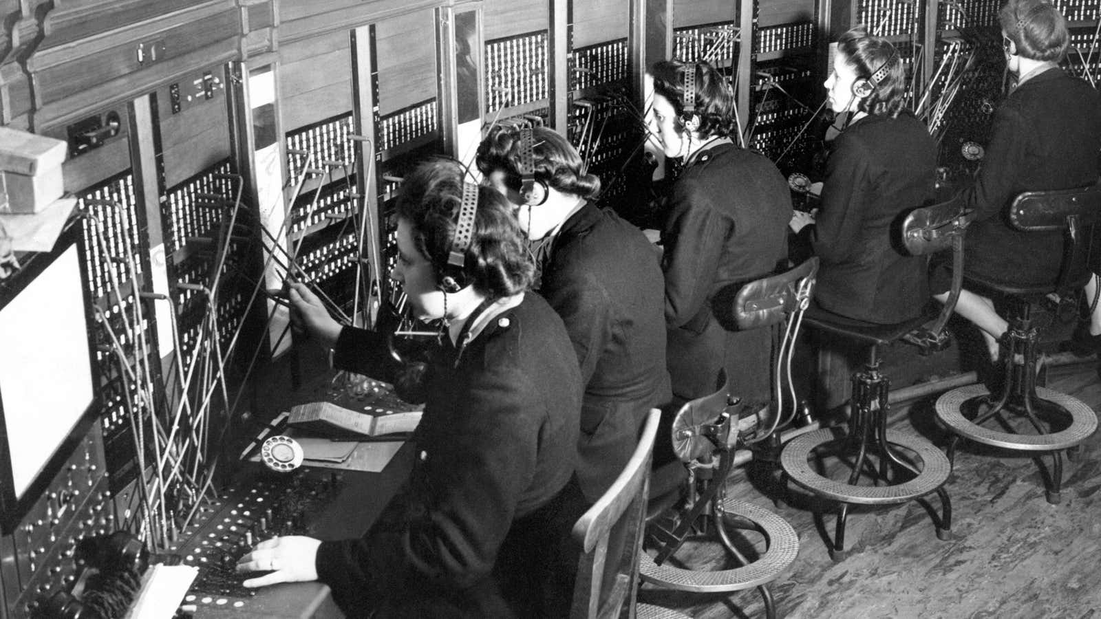 FILE -This March 20, 1944, file photo shows switchboard operators in London. An Associated Press investigation released in January 2013 found that millions of mid-skill, mid-pay jobs have disappeared over the past five years and have been replaced with technology. Peter Lindert, an economist at the University of California-Davis, does not believe workers are doomed to unemployment. With the right skills and education, Lindert, says, workers can learn to work with the machines. (AP Photo/File)