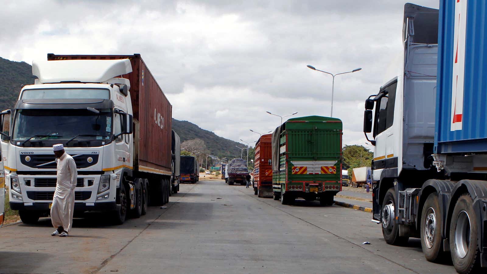 Transit trucks queue for customs processing between Kenya and Tanzania in Namanga, Tanzania