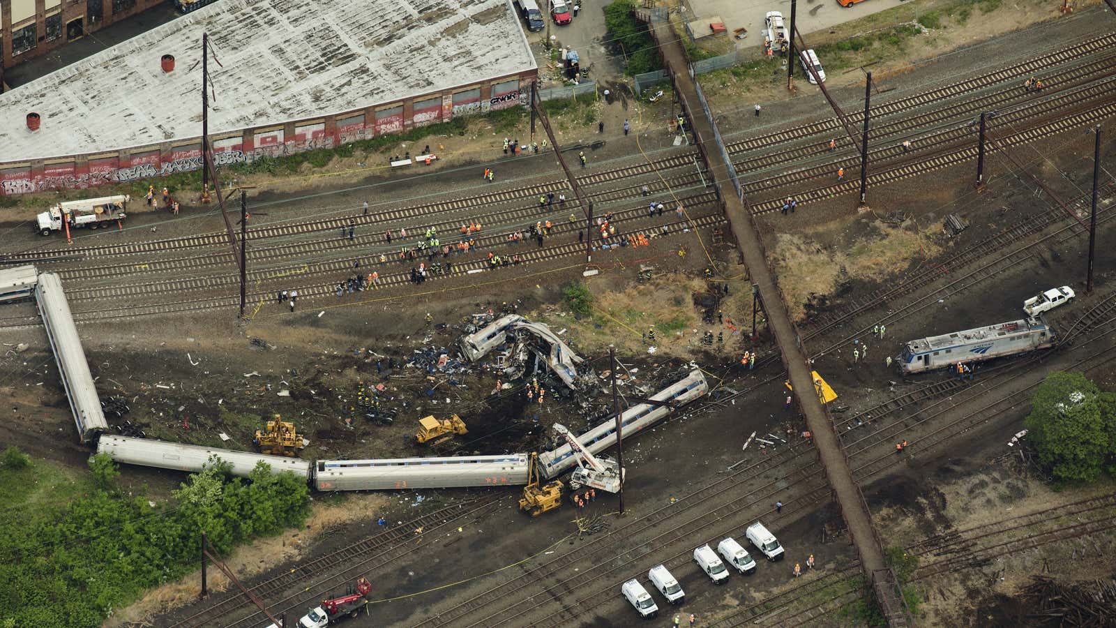 Emergency workers search for bodies inside a derailed Amtrak train in Philadelphia, Pennsylvania, May 12, 2015.