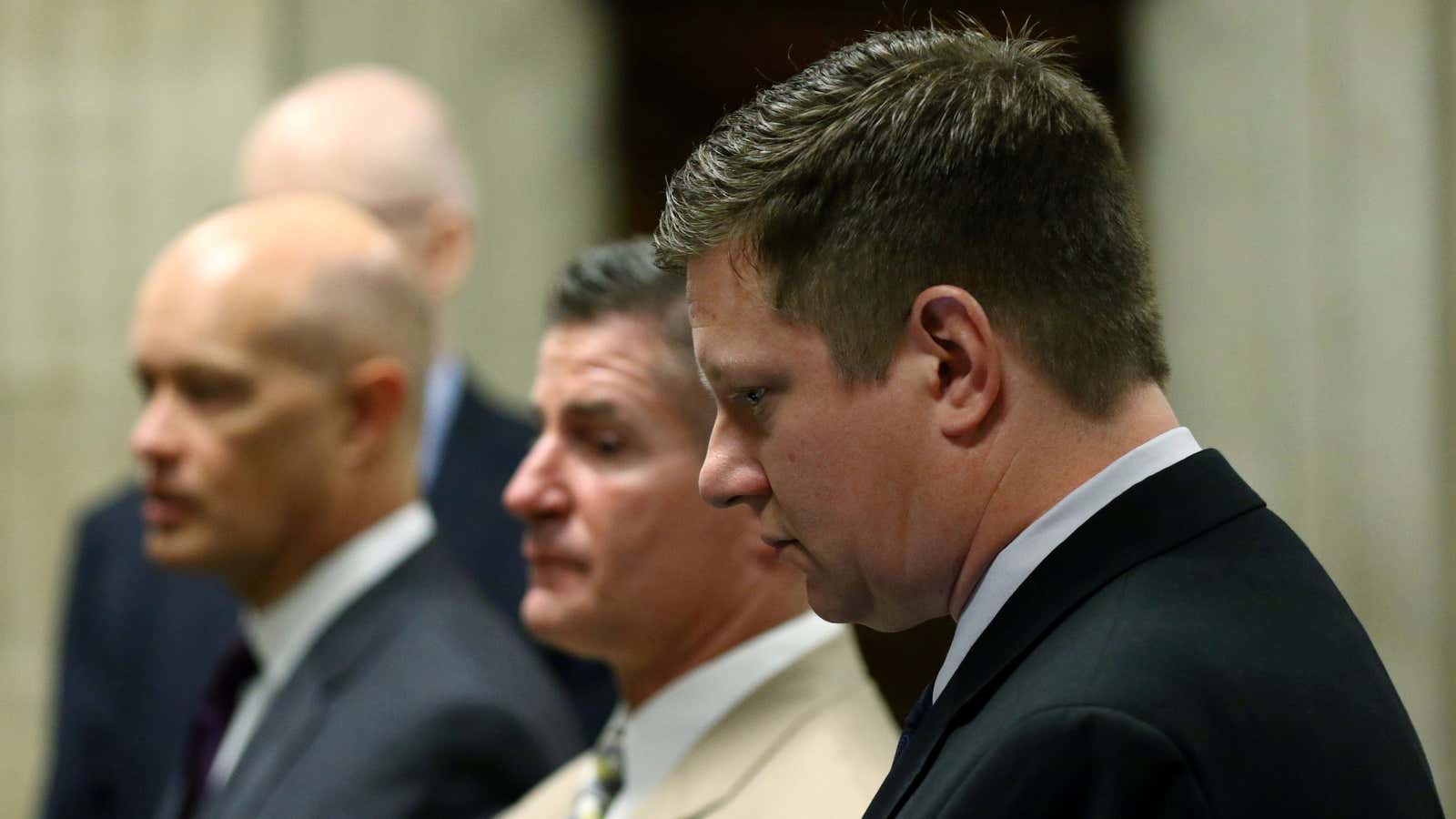 Chicago police Officer Jason Van Dyke stands with his attorneys during his murder trial.