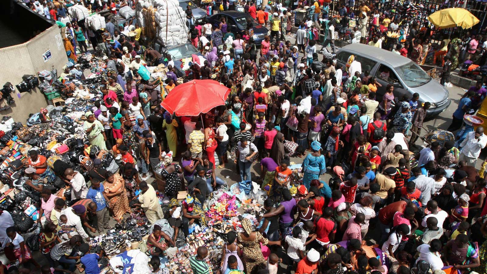 People crowd on a road near Balogun market, Lagos