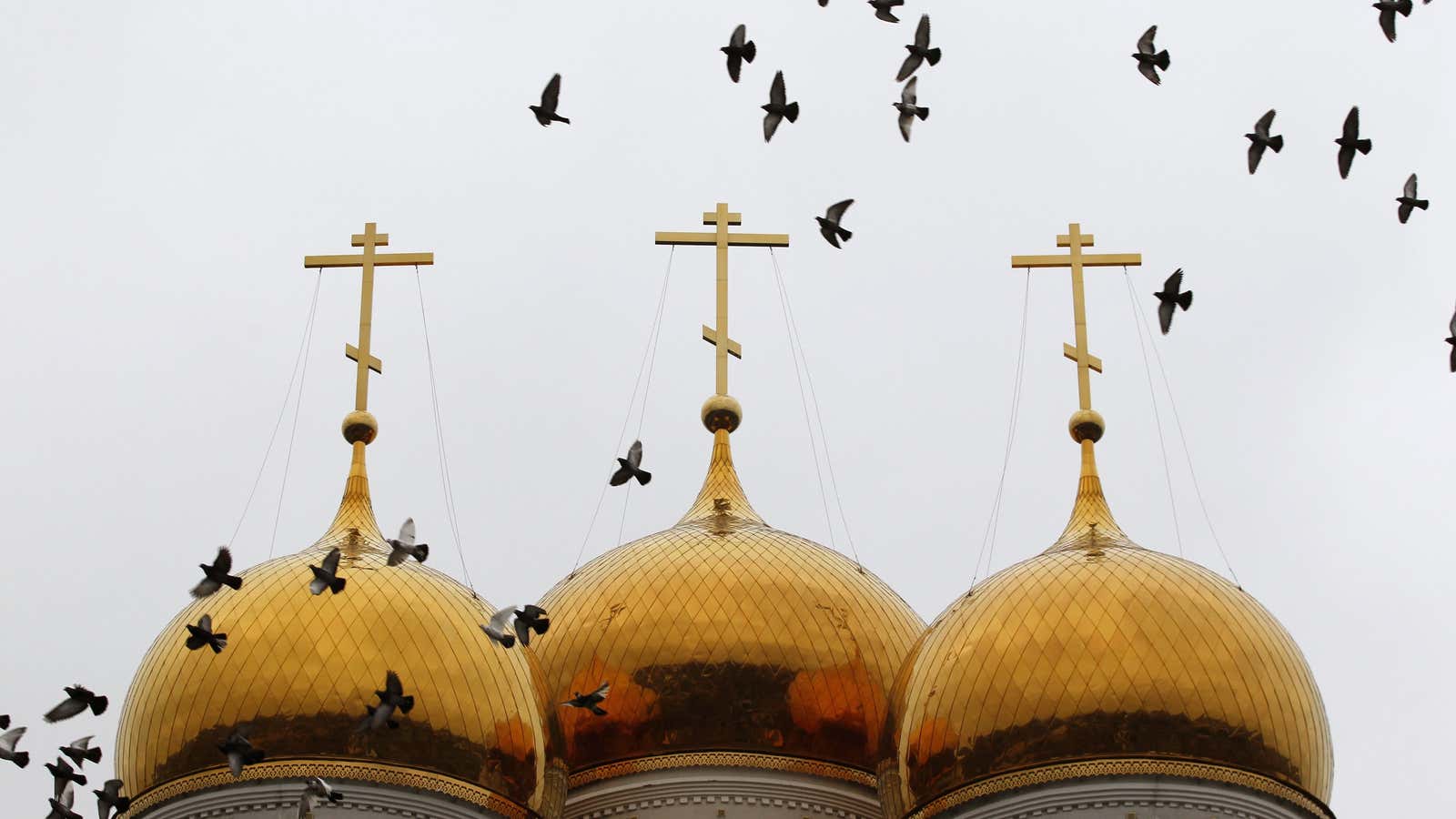 Birds fly over an Orthodox church in a monastery in the village of Nikolskoye, some 48 km (30 miles) from the eastern city of Donetsk.