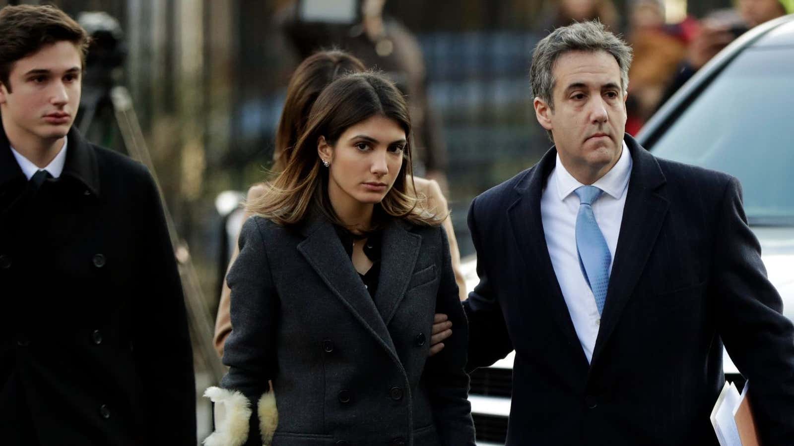 Cohen arrives in federal court last December with his children.
