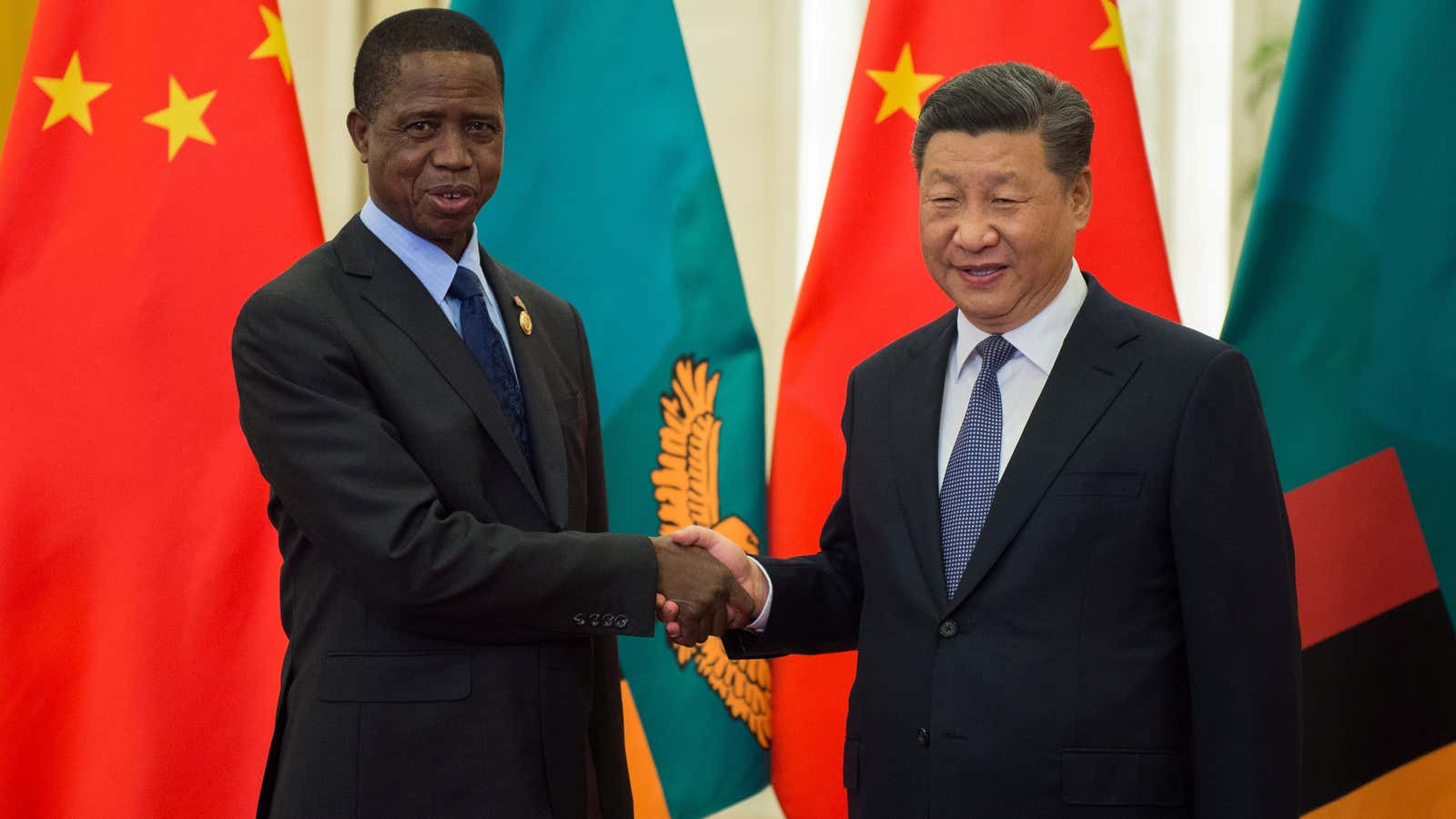 Zambia’s President Edgar Lungu shakes hands with China’s President Xi Jinping  in Beijing