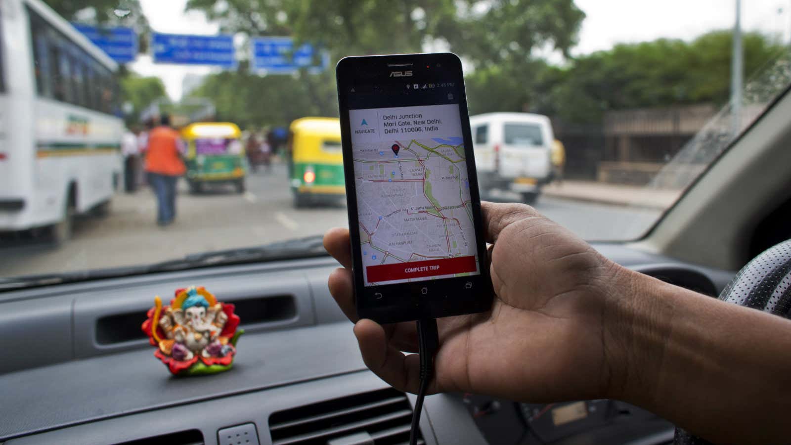 An Indian cab driver displays the city map on a smartphone provided by Uber as he drives in New Delhi, India, Friday, July 31, 2015.…
