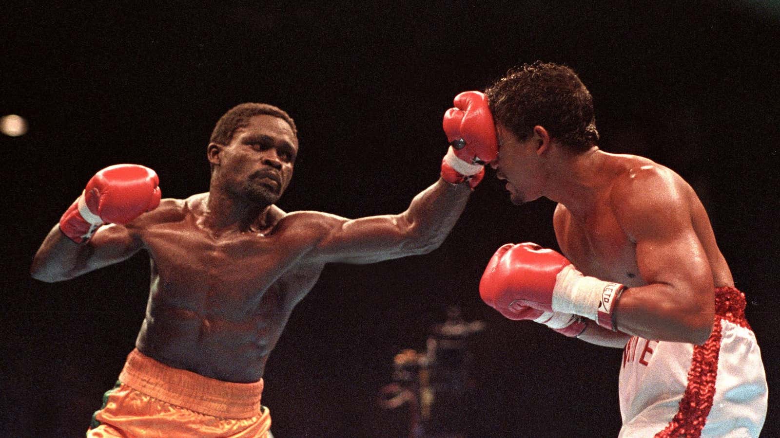 Ghana’s Azumah Nelson, from Jamestown, Accra, lands a jab to the face of Puerto Rico’s Juan LaPorte during a super-featherweight WBC title fight in 1990 in Sydney.