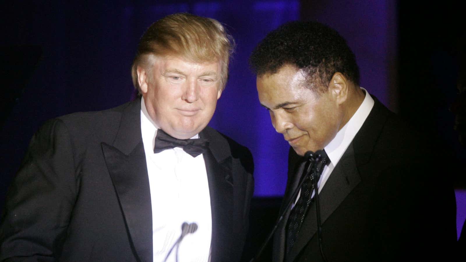 Trump accepts his Muhammad Ali award from Ali at Muhammad Ali’s Celebrity Fight Night XIII,  March 24, 2007.