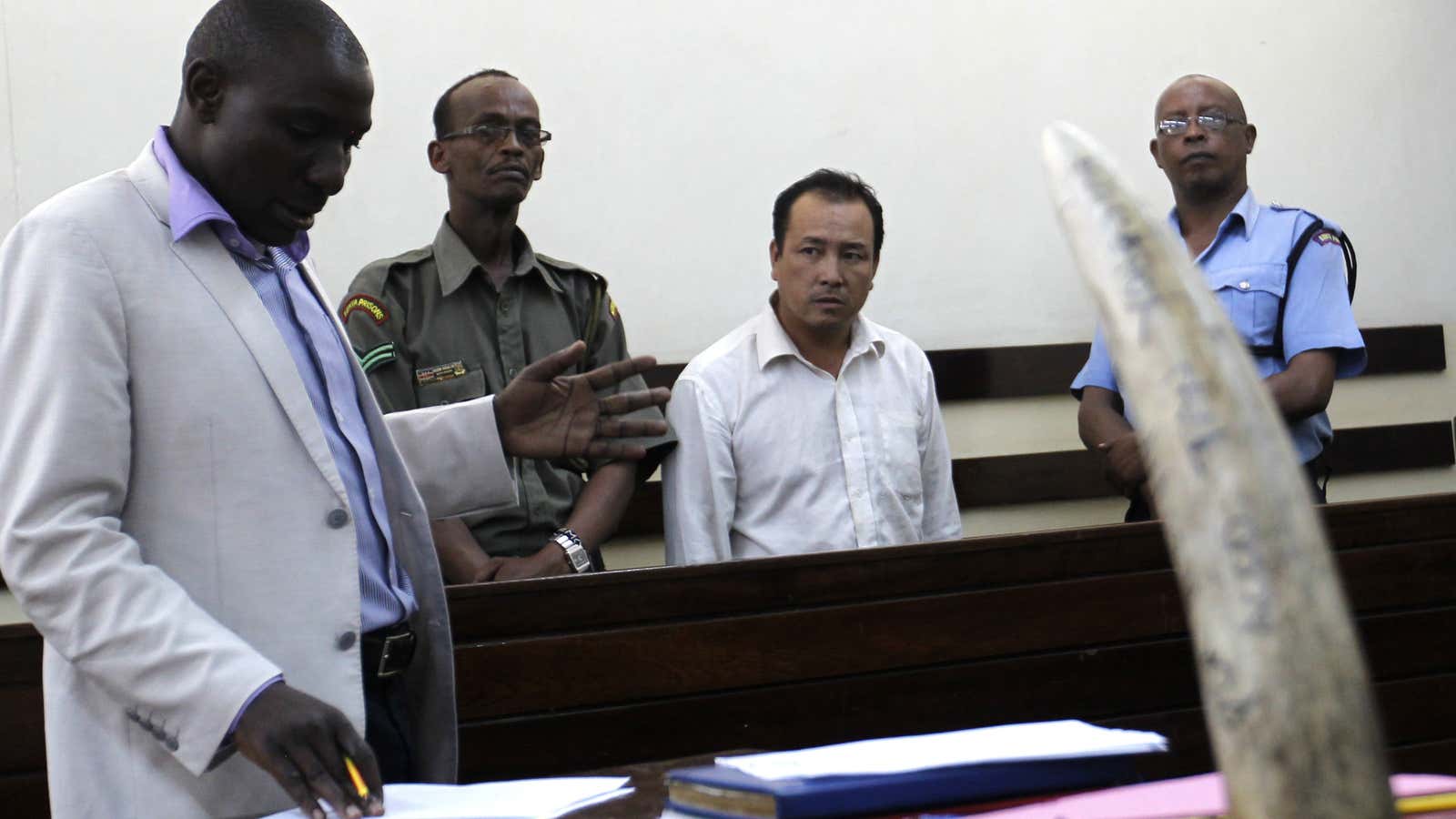 A Chinese national, stands inside the dock at the Makadara Law courts in Kenya’s capital Nairobi, arrested for trying to smuggle raw elephant ivory to Guangzhou