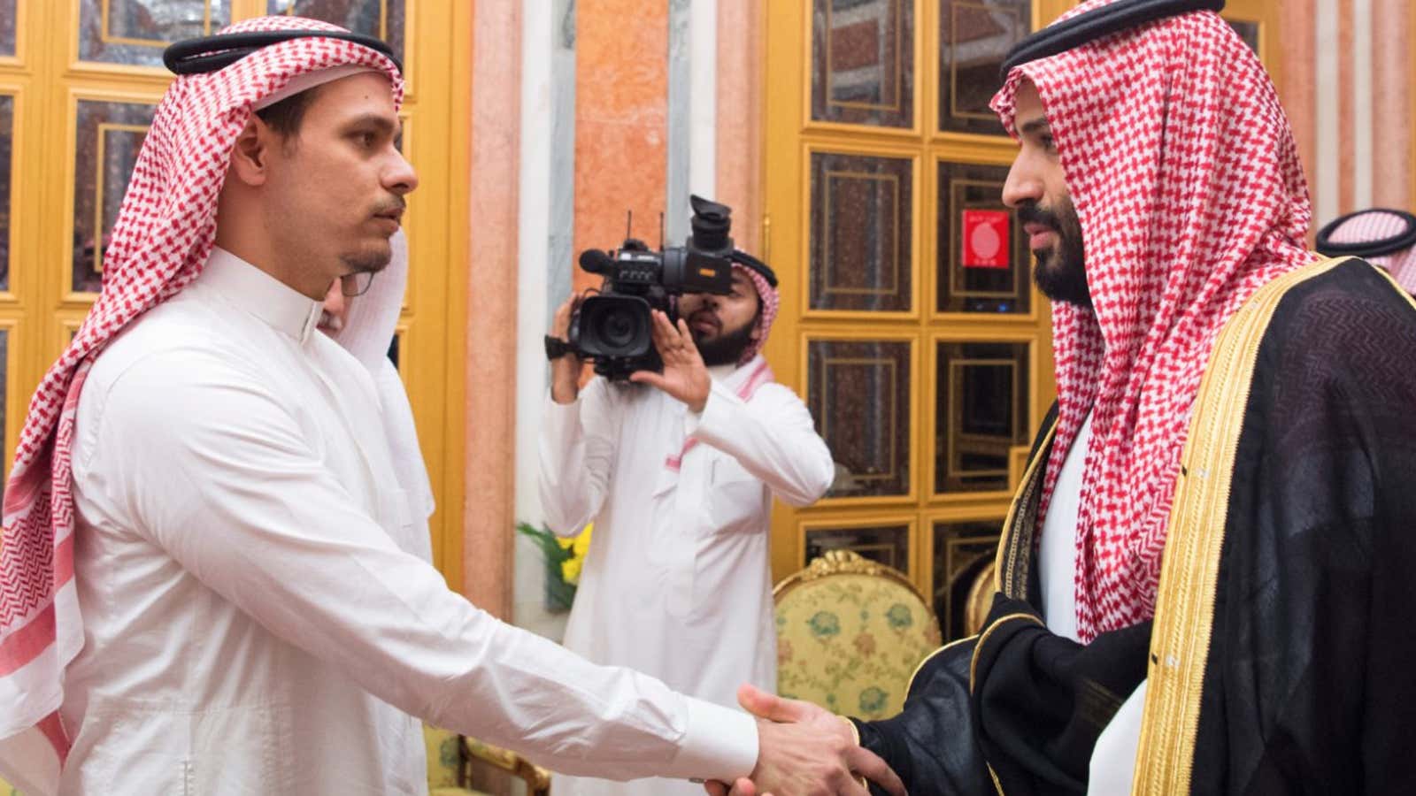 Mohammed bin Salman shaking hands with Jamal Khashoggi’s son, Salah.
