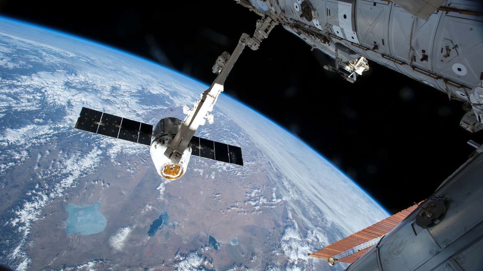 A SpaceX spacecraft brings a load of cargo to the International Space Station in 2015.
