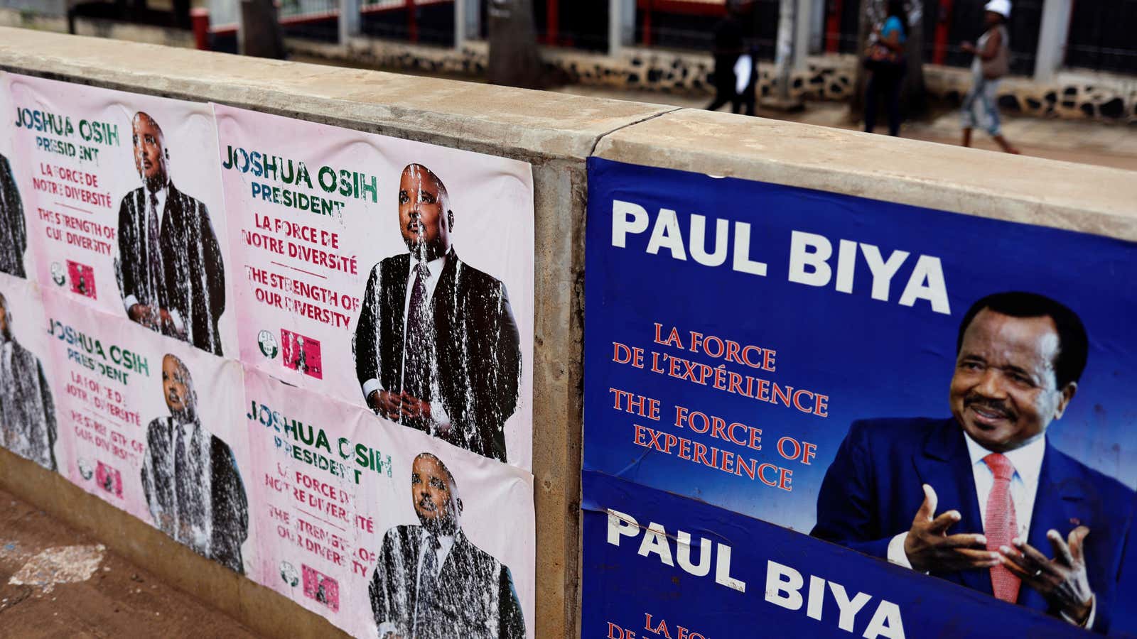 Electoral posters for Cameroon President Paul Biya and candidate Joshua Osih of Social Democratic Front party in Yaounde, Cameroon