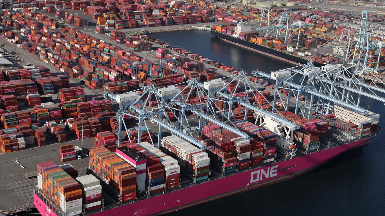 Pop quiz! Can you find space in this congested shipping yard to neatly stack the thousands of containers that need to be unloaded from this ship?