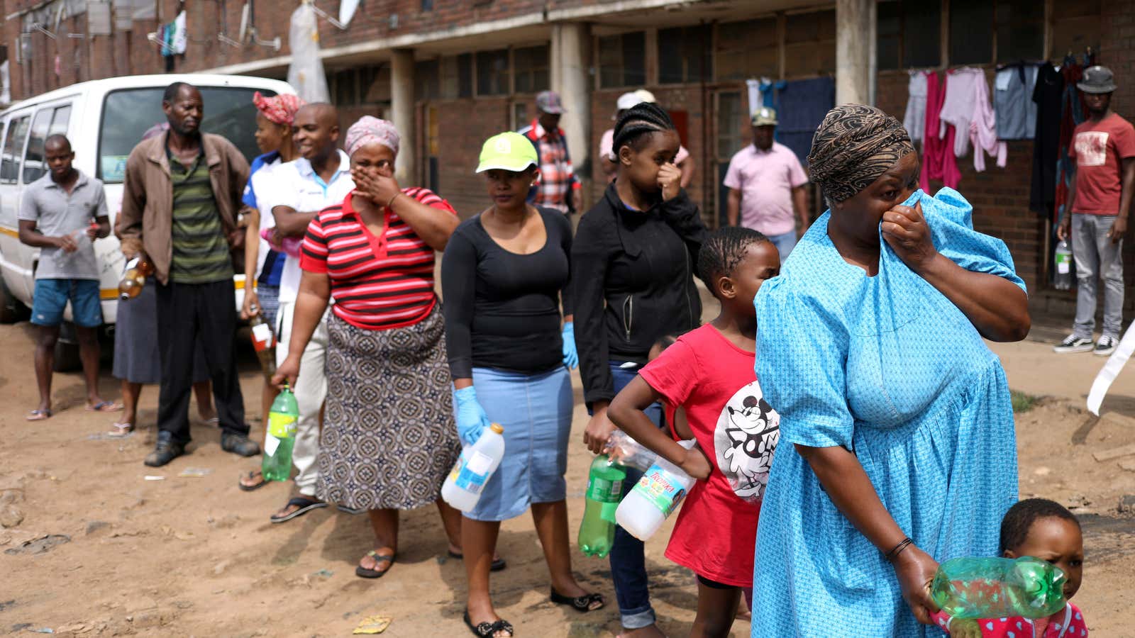 Residents of Alexandra queue to collect sanitizer from health workers during a South Africa’s lockdown  April 1, 2020.